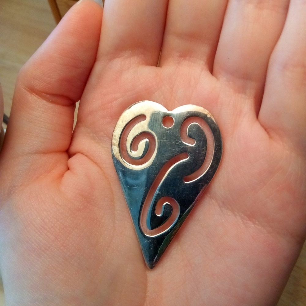 Minimalist sterling silver carved heart pendant